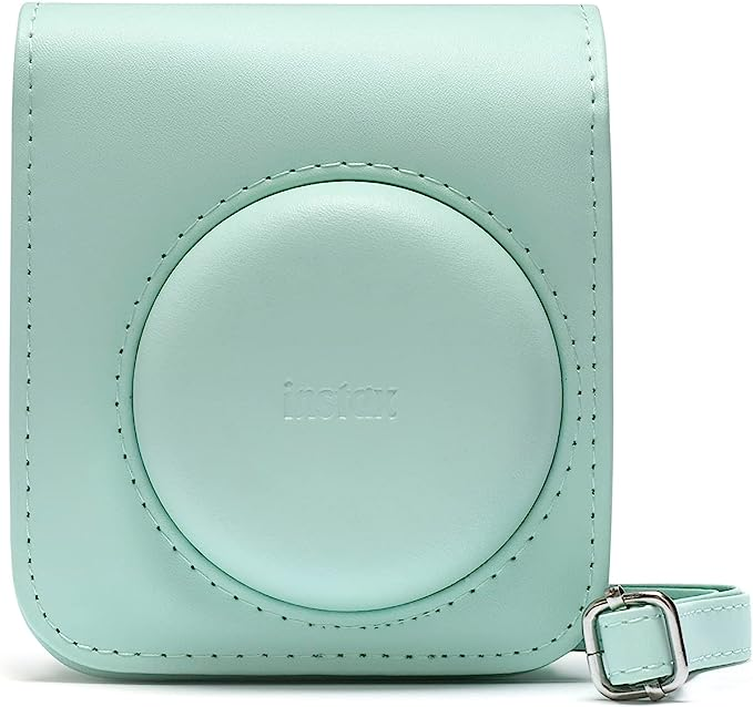Una funda para cámara instax de color verde azulado con una correa.