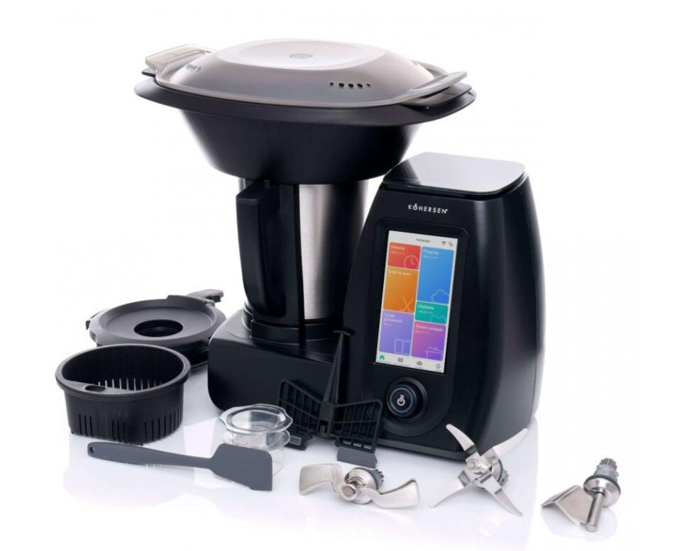 Czarne urządzenie kuchenne z akcesoriami: ostrza, szpatułka, miska.