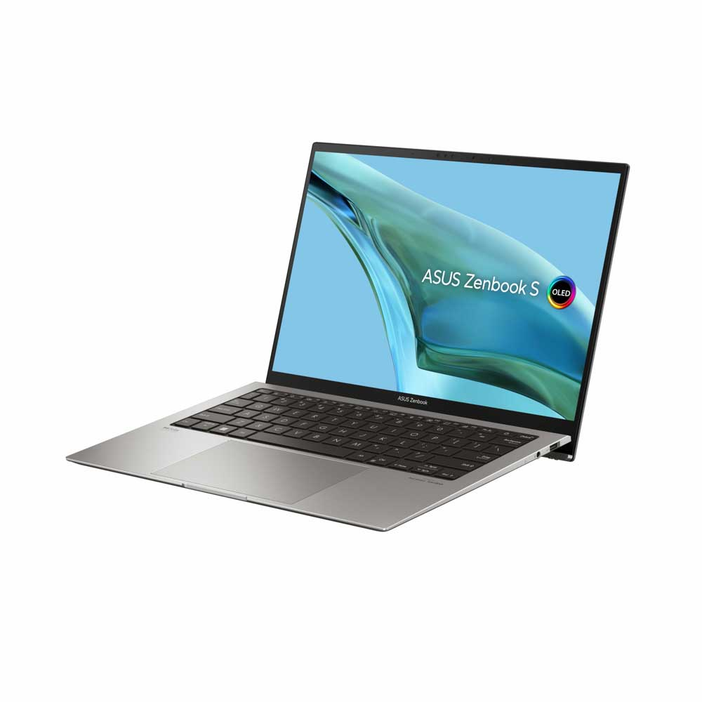 Açık gümüş dizüstü bilgisayar, 'ASUS Zenbook S OLED' metnini içeren bir ekran gösteriyor.