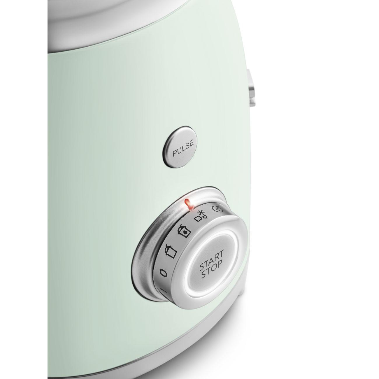 Nahaufnahme eines mintgrünen Toasters mit Start/Stopp-Drehrad. Das Wort 'Puls' steht darüber.