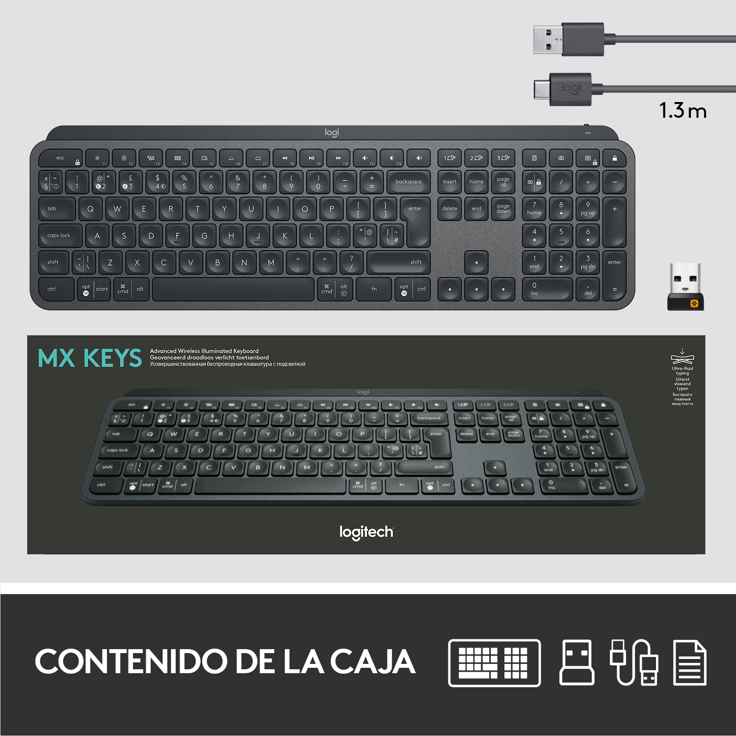 Teclado, cable USB y dongle en una caja. Superficie blanca, teclado negro.