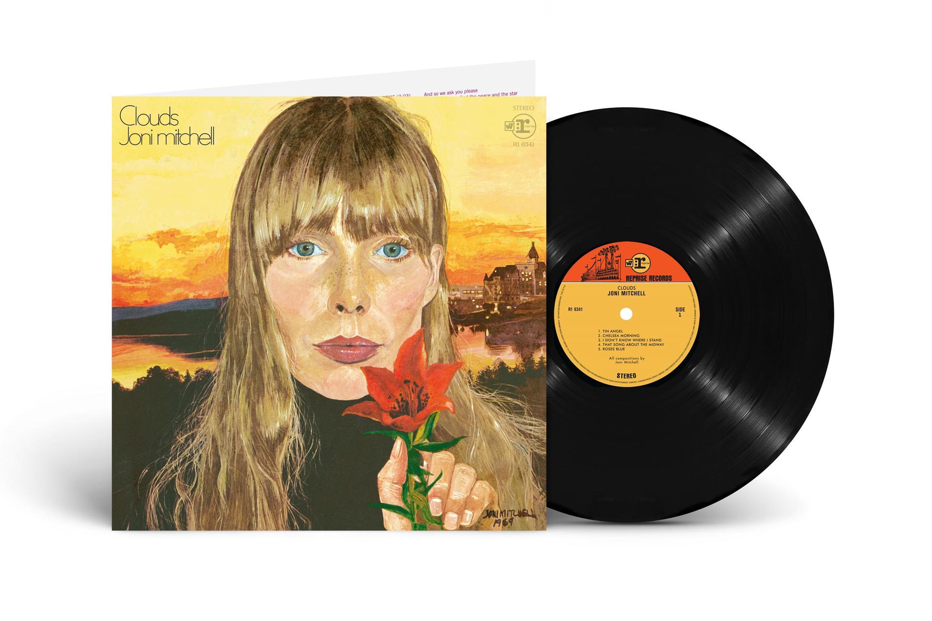 Ein Schallplattencover zeigt eine Frau mit langen Haaren, die eine Blume hält, mit einem Sonnenuntergang im Hintergrund.