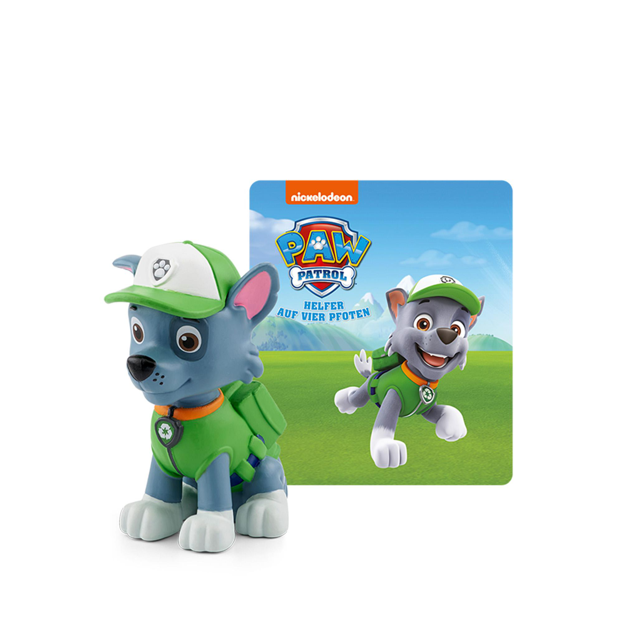 Ein Paw Patrol Spielzeug eines Welpen mit grünem Hut und Weste. Daneben ein Bild des Welpen.