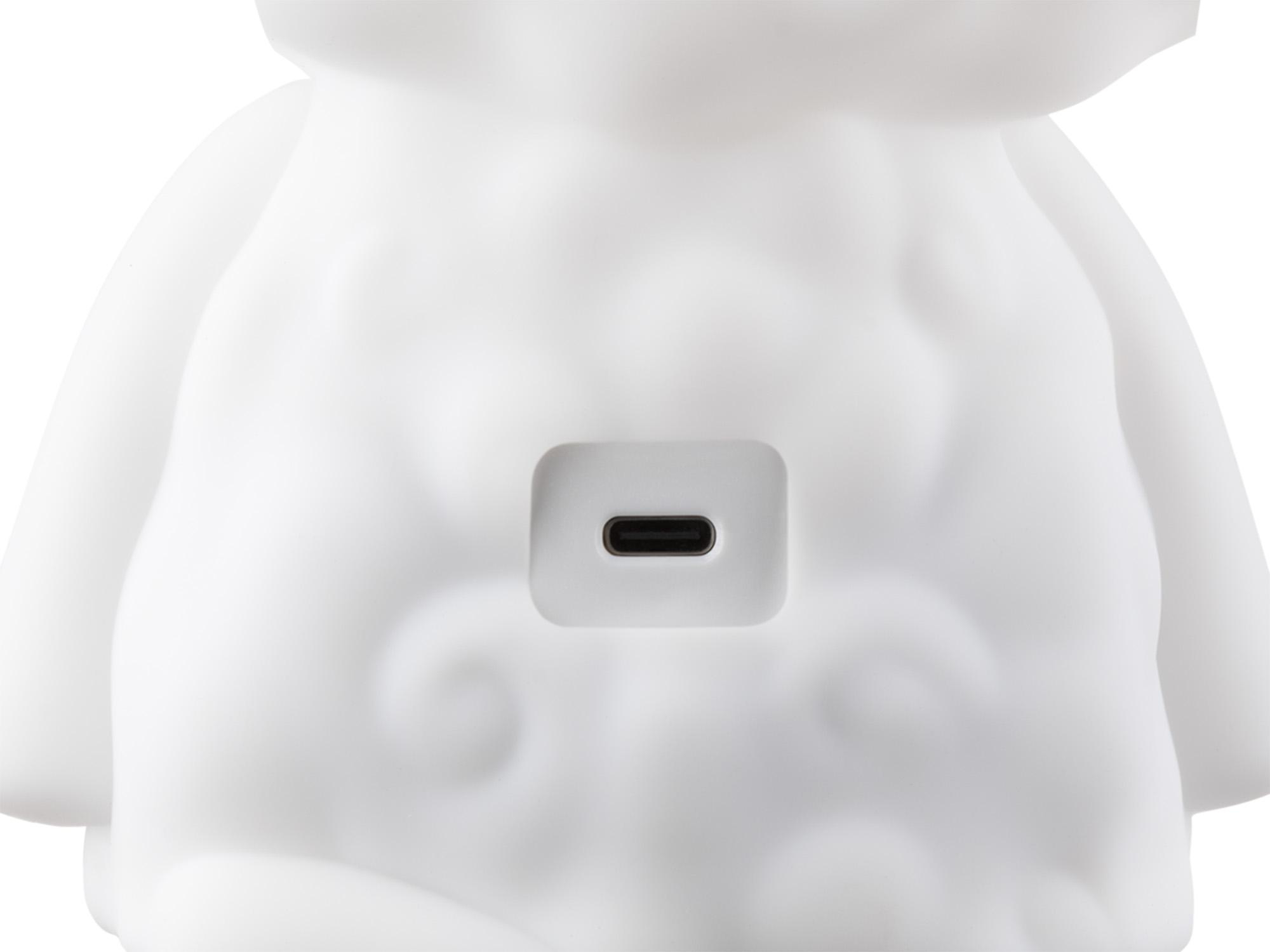 Weiße schafsförmige Lampe mit einem USB-C-Anschluss auf der Rückseite.