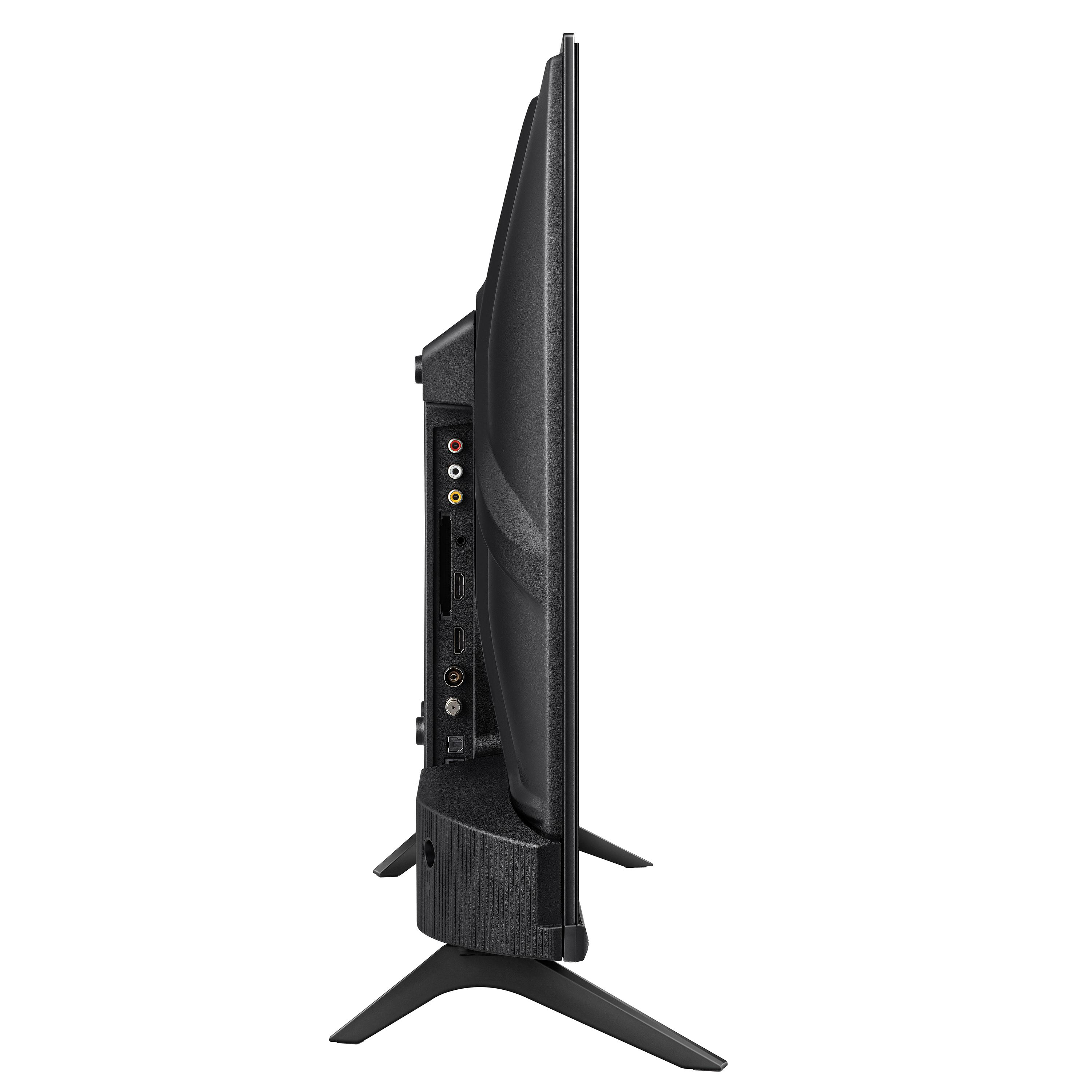 Ein schwarzer Fernseher von der Seite, mit Anschlüssen und Ständer. Der Fernseher steht vor weißem Hintergrund.