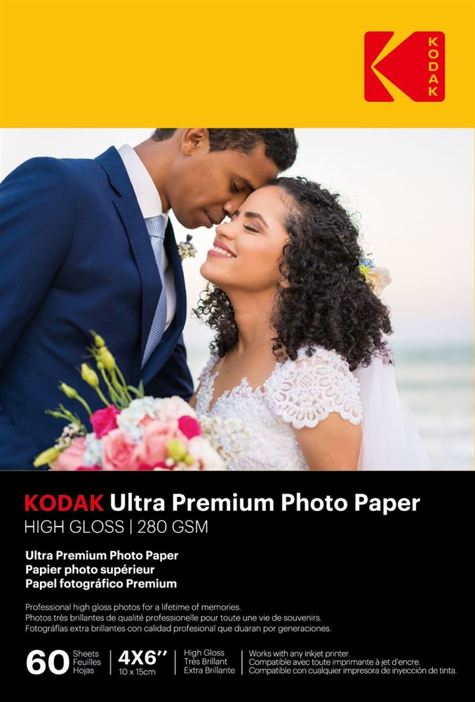 Kodak fotópapír csomagolás. Egy pár öleli egymást egy virágcsokor előtt.