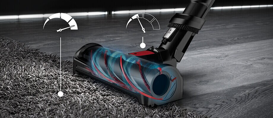 Głowica odkurzacza na dywanie, ze wskaźnikami wydajności. Czerwone i niebieskie elementy wewnętrzne.