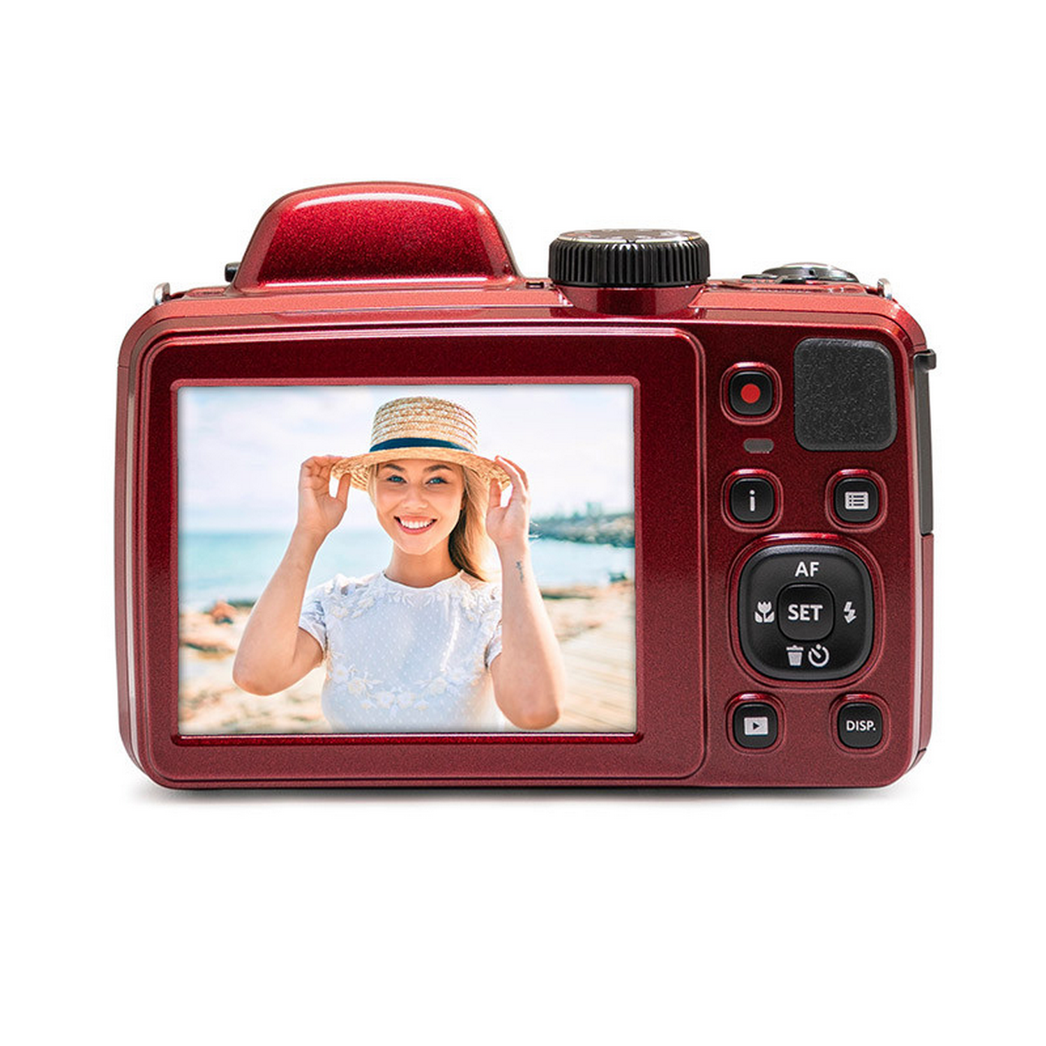 Een rode camera toont een foto van een lachende vrouw op het strand.