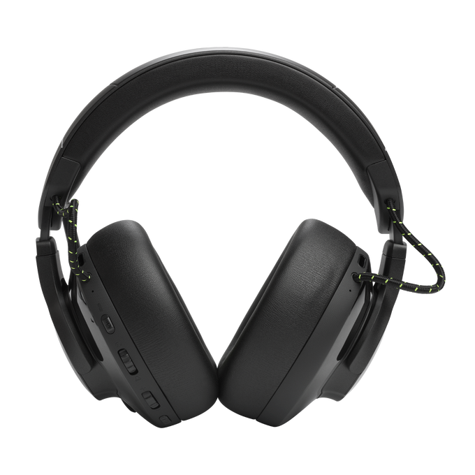 Auriculares negros con cable negro y amarillo, sobre un fondo negro.