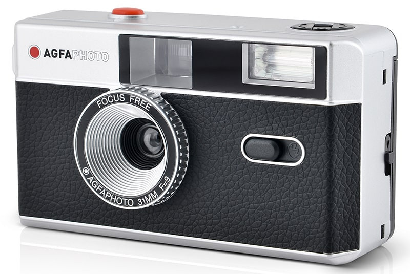 Silver and black AGFA photo camera. It has a red button and focus free.