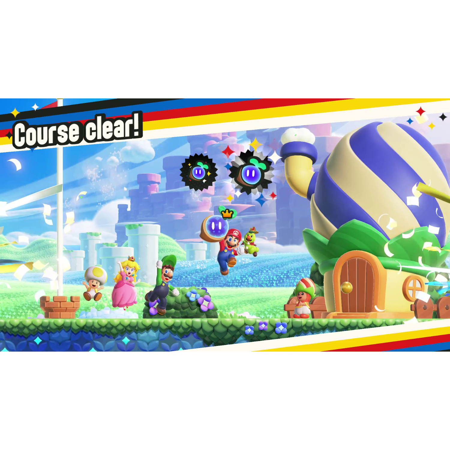 Mario characters celebrate a clear course. A large balloon-like structure is in the background.