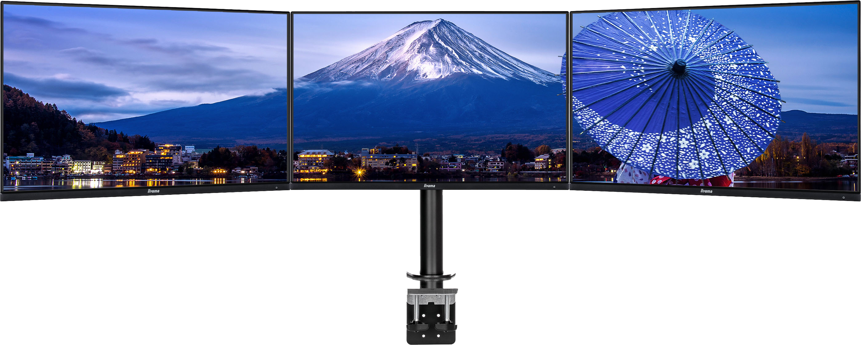 Drei Monitore, die verschiedene Landschaften und einen Berg zeigen. Schwarzer Hintergrund.