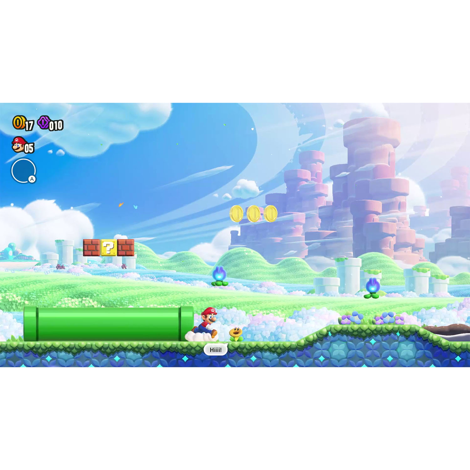Uno schermo del videogioco di Mario con Mario, un tubo verde e monete in un paesaggio colorato.