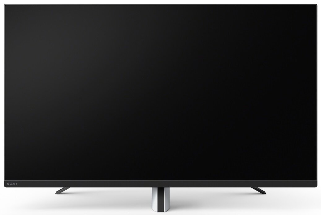 Duży czarny ekran telewizora. Ekran jest włączony i wyświetla pusty, ciemny obraz.