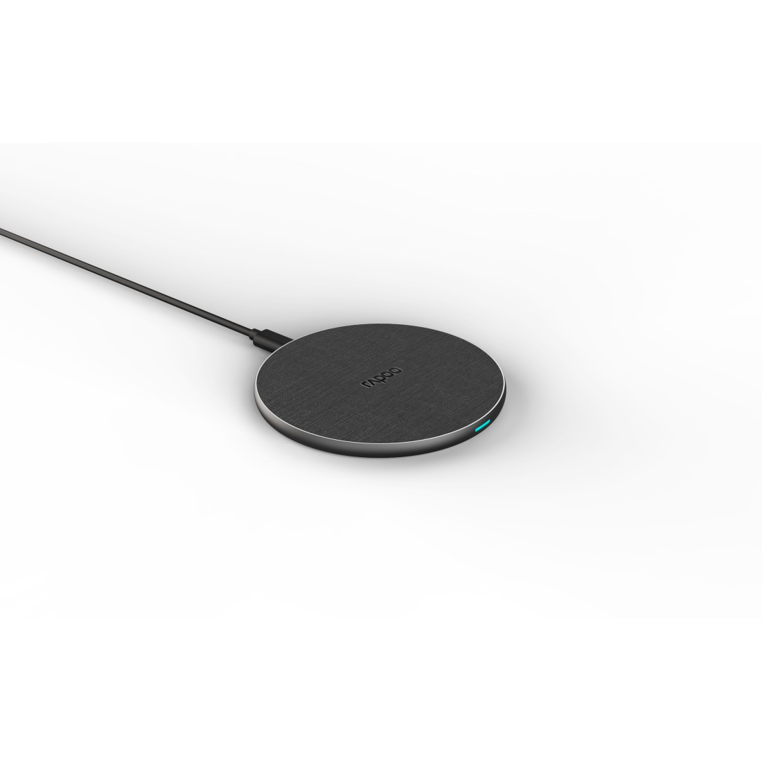 Rundes, graues kabelloses Ladegerät mit schwarzem Kabel und blauer LED-Anzeige auf weißem Hintergrund.