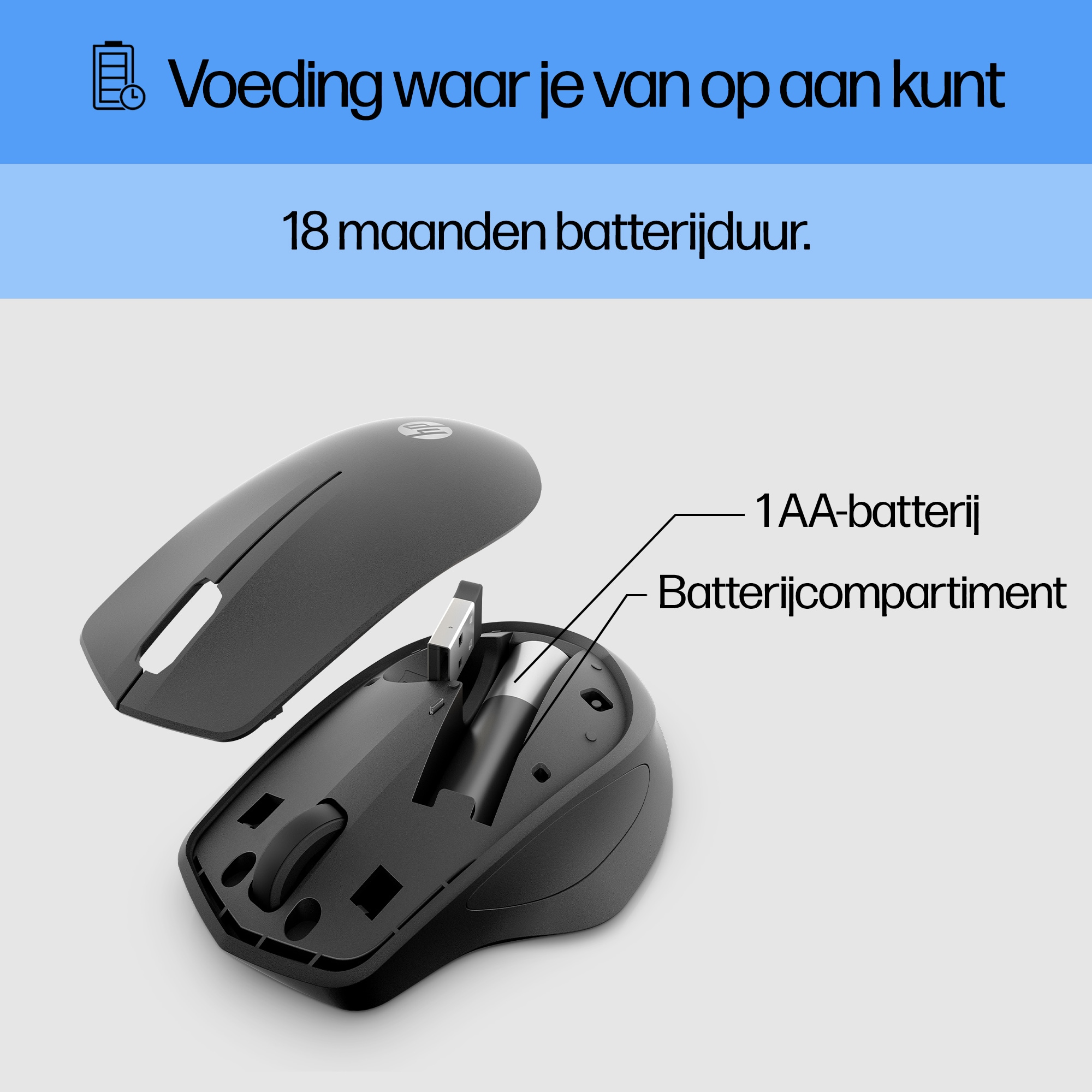 Black computer mouse with a removable cover showing a battery compartment.
