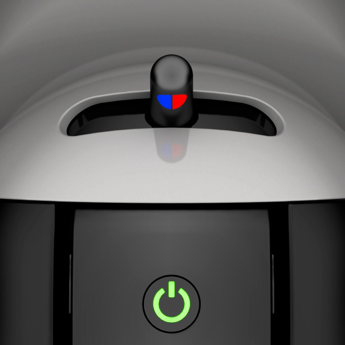 Zbliżenie ekspresu do kawy z podświetlanym zielonym przyciskiem zasilania i innymi wskaźnikami.