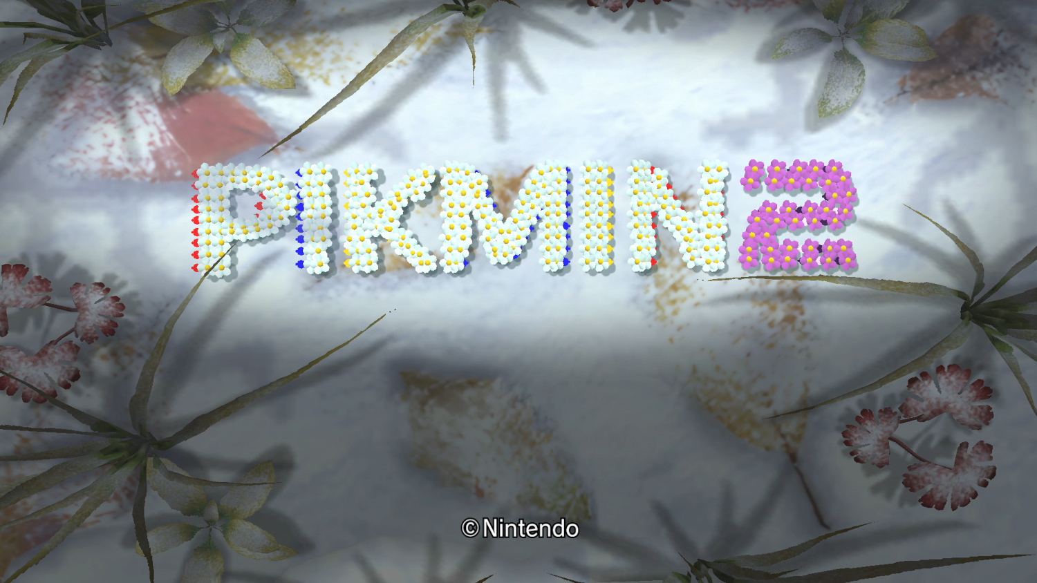 Écran titre de Pikmin 2 avec des fleurs stylisées.