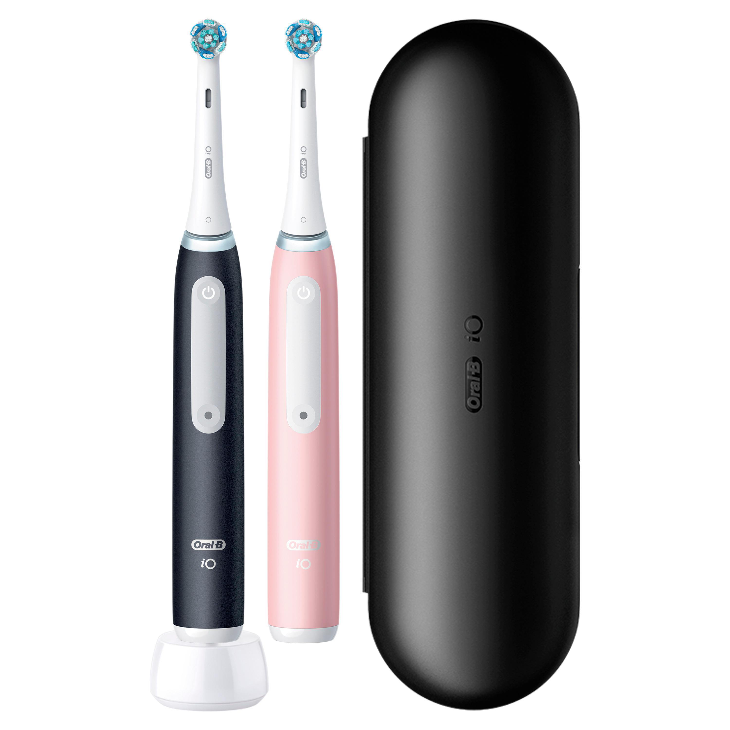 Zwei elektrische Zahnbürsten, rosa und schwarz, mit Ladestation und Reiseetui.