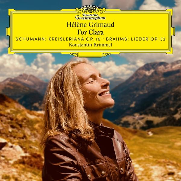 Albumcover mit einer Frau, die in die Sonne lächelt, Berge und Himmel im Hintergrund.