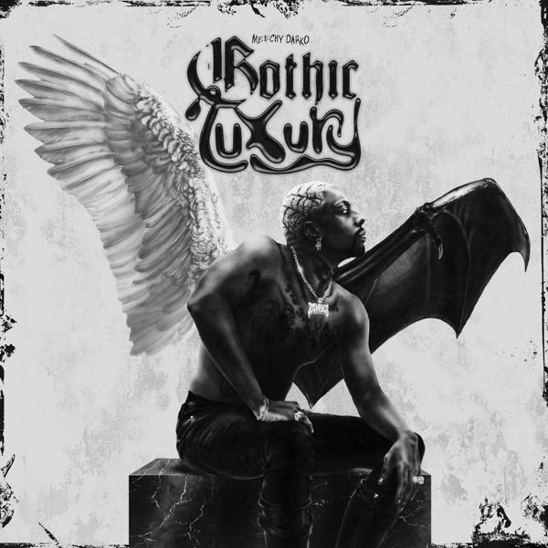 Album borító: Férfi szárnyakkal, meztelenül, ülve. Cím: Gothic Luxury. Fekete-fehérben.