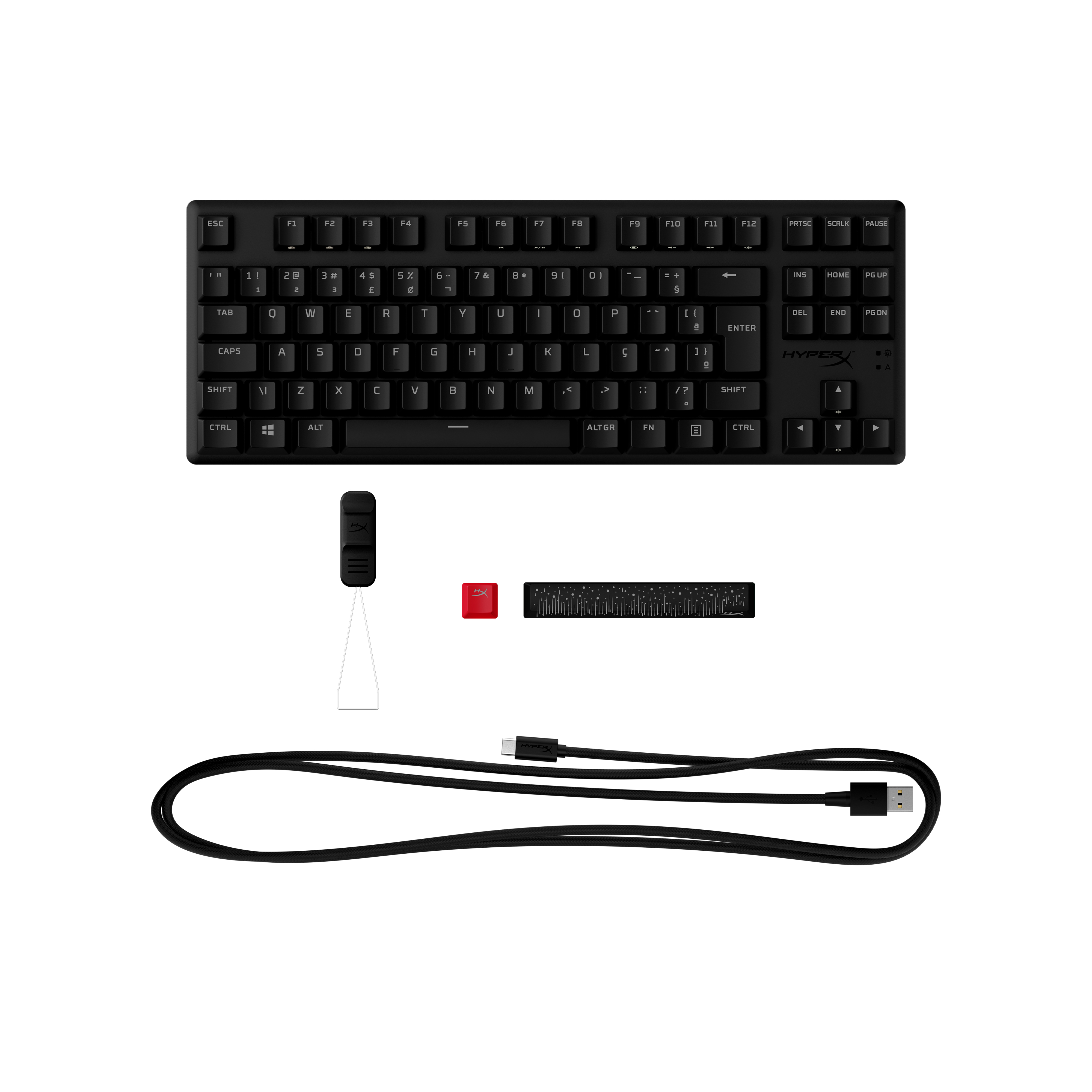 Un teclado negro con teclas y accesorios. Incluye una tecla roja y un cable.