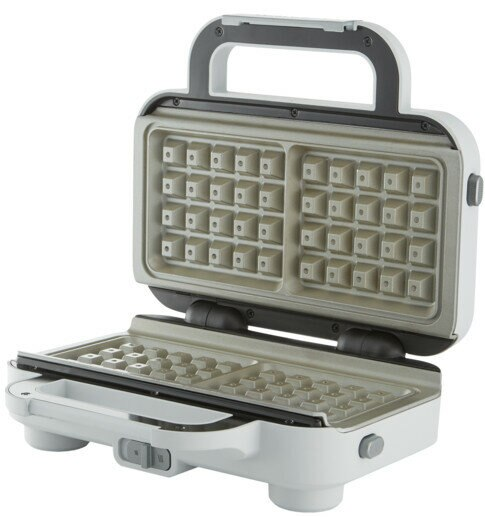 Otwarta biała gofrownica, pokazująca powierzchnie do gotowania z wzorami siatki.