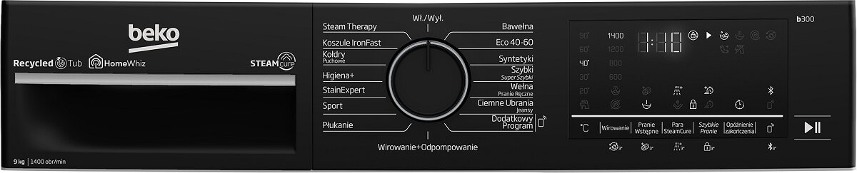 Czarny panel sterowania pralki. Ma pokrętło, przyciski i wyświetlacz. Widoczne logo beko.