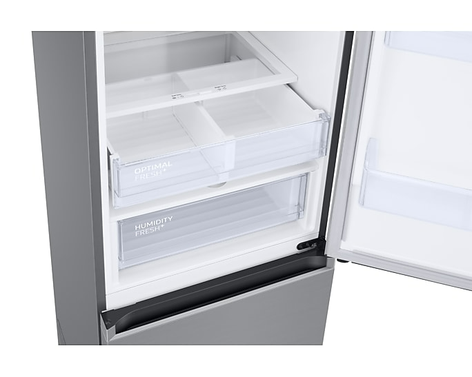 Hűtő belseje nyitott ajtóval. Átlátszó műanyag fiókok, melyek 'Optimal Fresh' és 'Humidity Fresh' feliratúak.