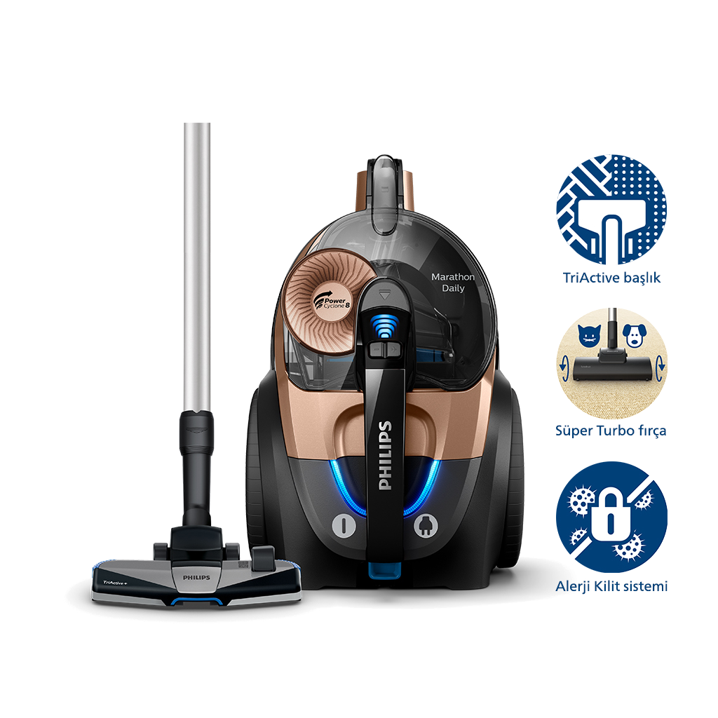 Ekleri olan altın ve siyah bir elektrikli süpürge. Karanlık bir arka planda.