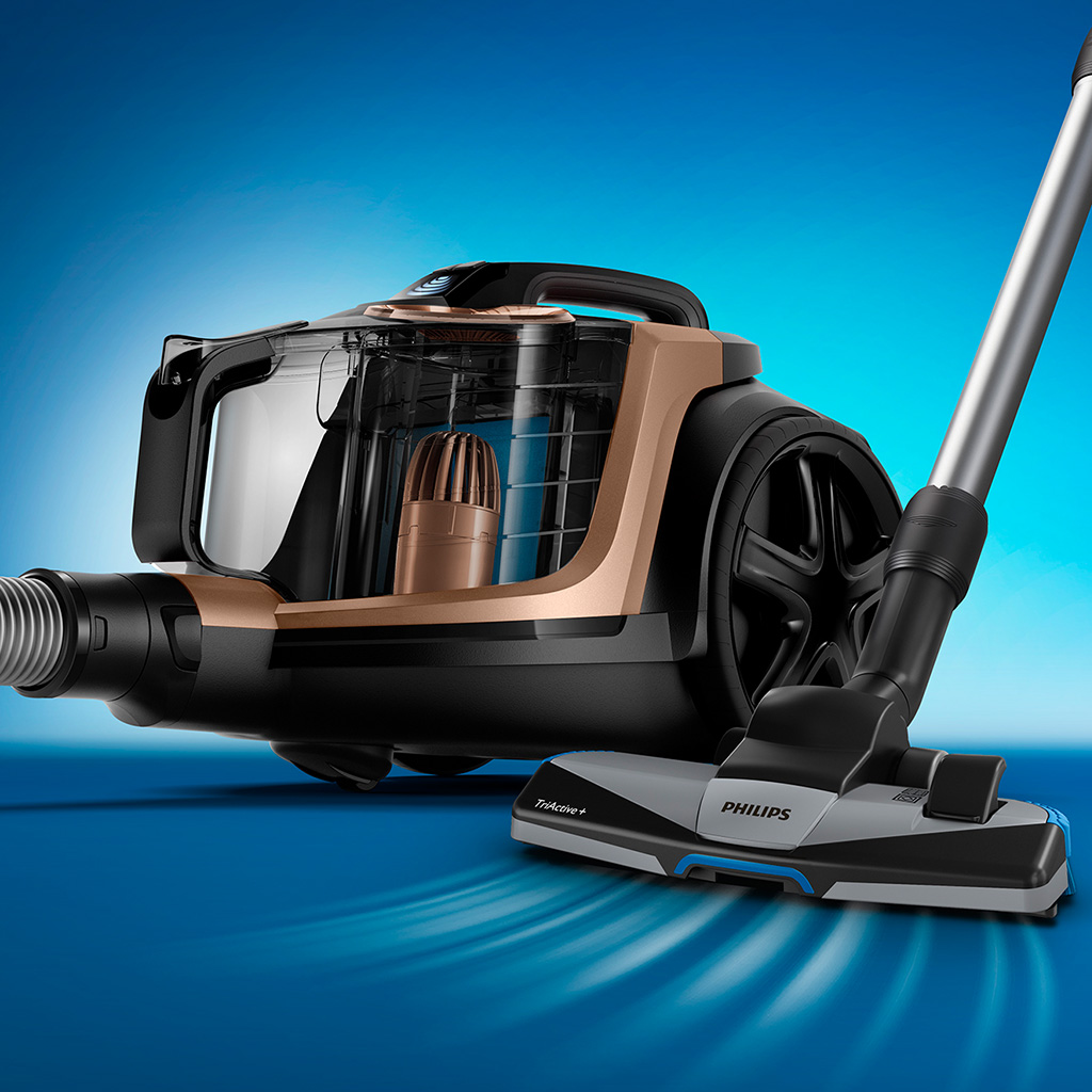 Mavi bir yüzey üzerinde mavi vurgulara sahip bir Philips elektrikli süpürge.