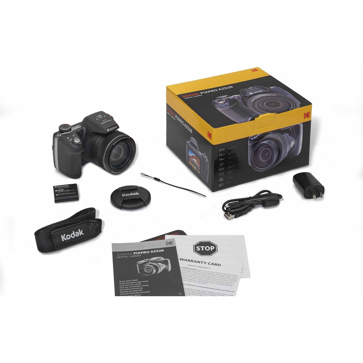 Kodak camera en accessoires op witte ondergrond. De doos is geel en zwart. Inclusief camerariem en garantiekaart.
