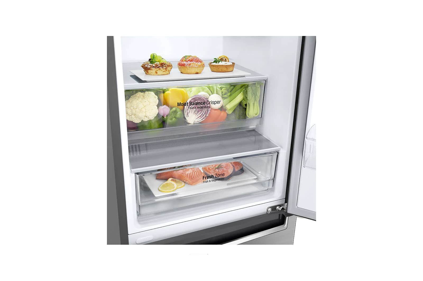 Wnętrze lodówki. Górna szuflada: warzywa. Środkowa szuflada: warzywa. Dolna szuflada: łosoś i cytryny.