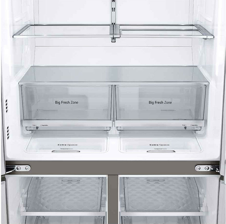 Wnętrze lodówki. Przezroczyste szuflady z napisami "Big Fresh Zone" i "Extra Space".