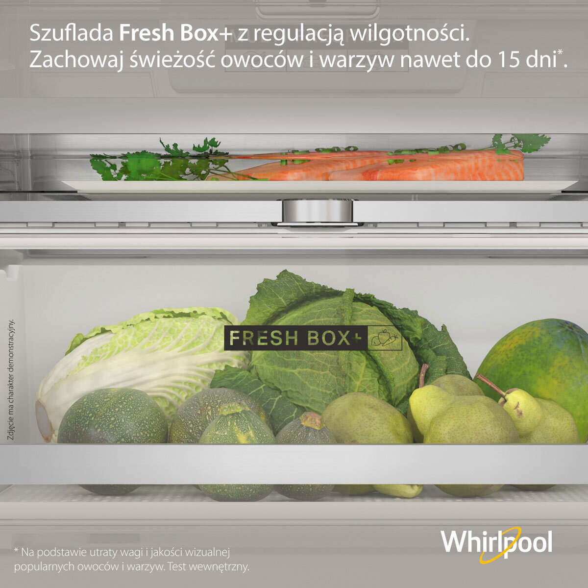 Szuflada lodówki ze świeżymi warzywami. Zbliżenie na sałatę i marchew. Tekst brzmi 'Fresh Box'.