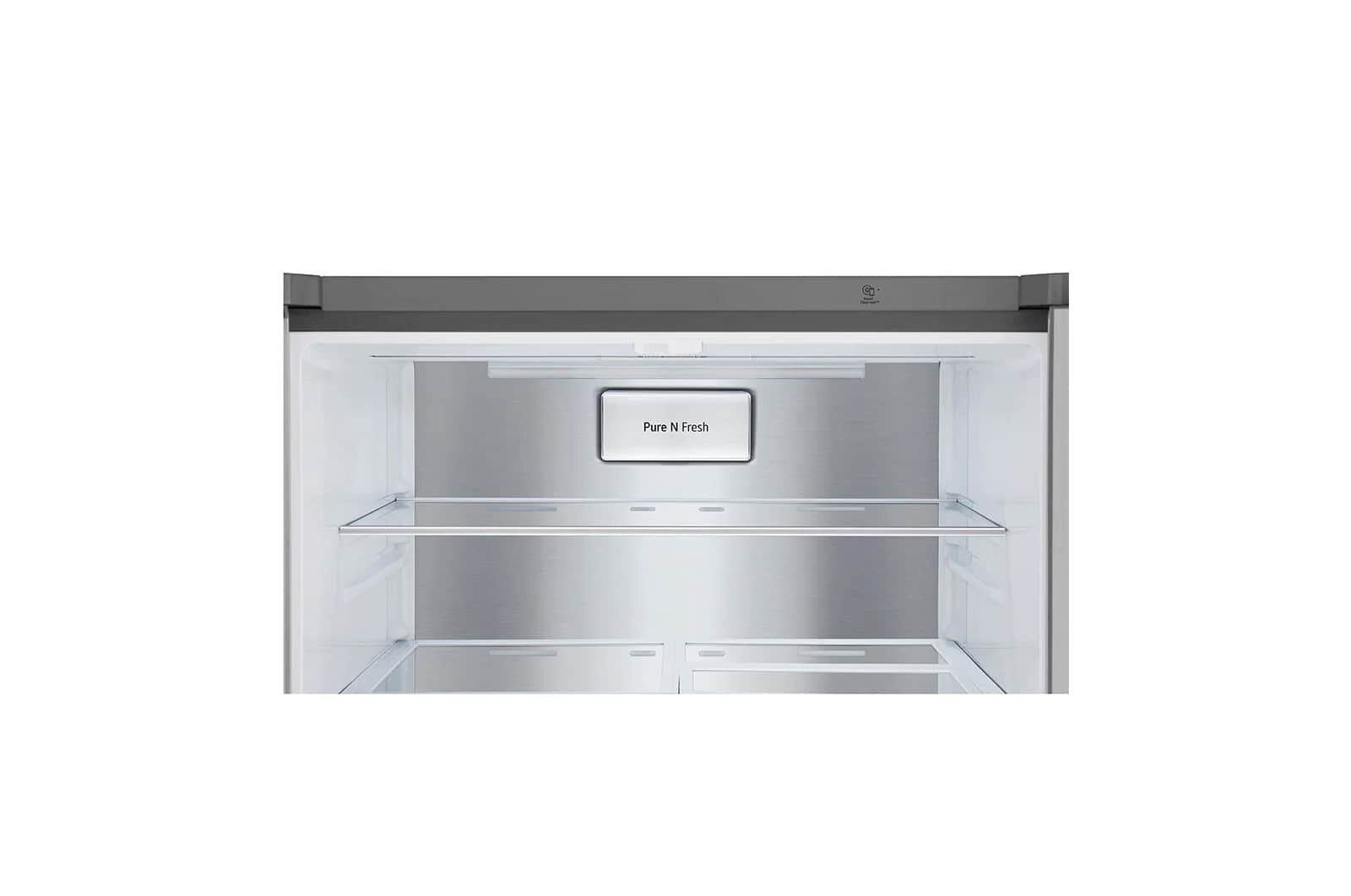 Wnętrze lodówki. Puste półki i etykieta 'Pure N Fresh'.