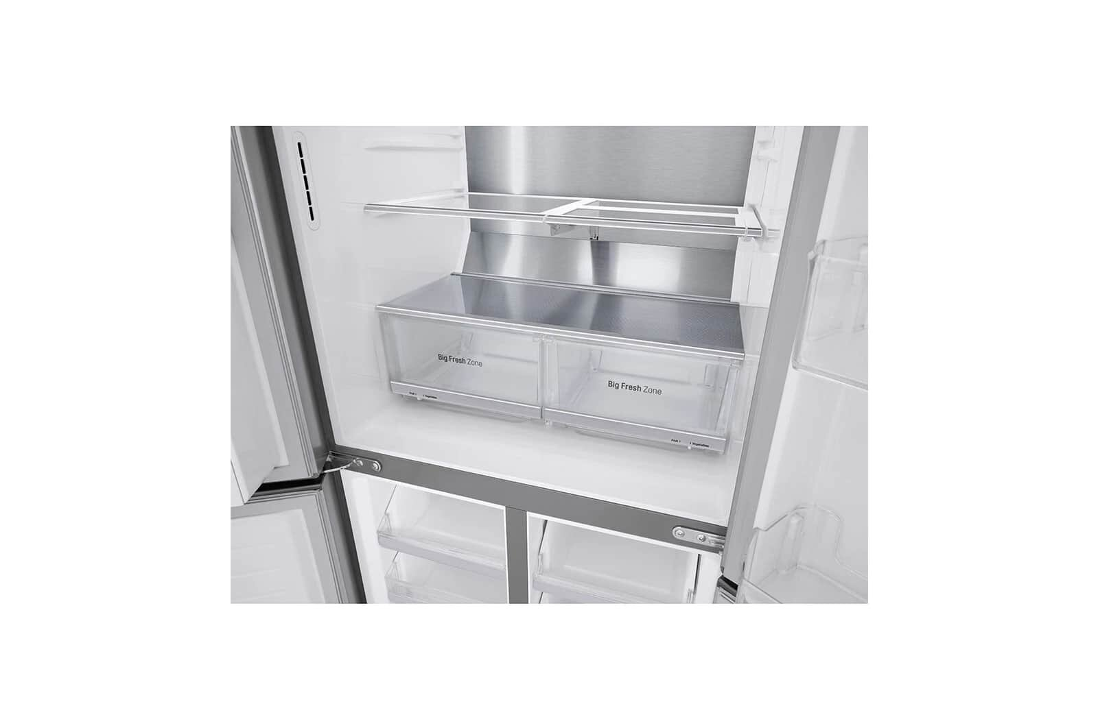 Wnętrze lodówki z dwiema przezroczystymi szufladami z napisem Big Fresh Zone.