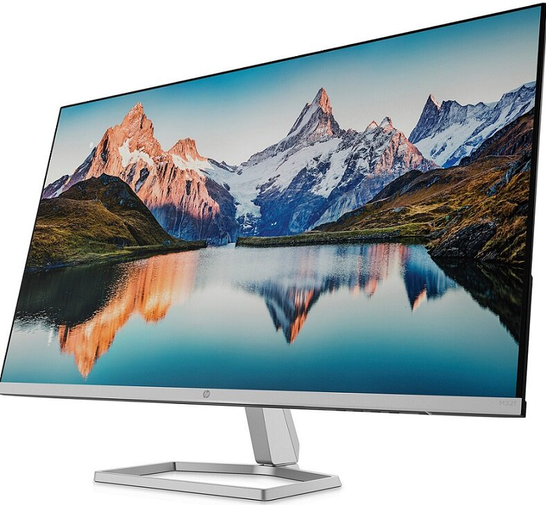 Monitor HP wyświetlający scenę z górskim jeziorem i ośnieżonymi szczytami.