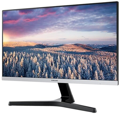Monitor Samsung wyświetla zimową scenerię z ośnieżonymi drzewami i kolorowym niebem. Jest na czarnym stojaku.