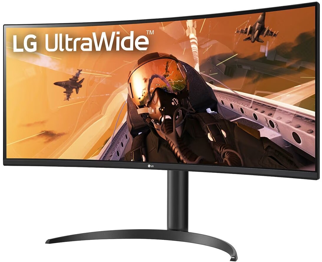 Zakrzywiony monitor LG ultra-szeroki pokazujący widok z kokpitu myśliwca odrzutowego na pomarańczowym niebie.