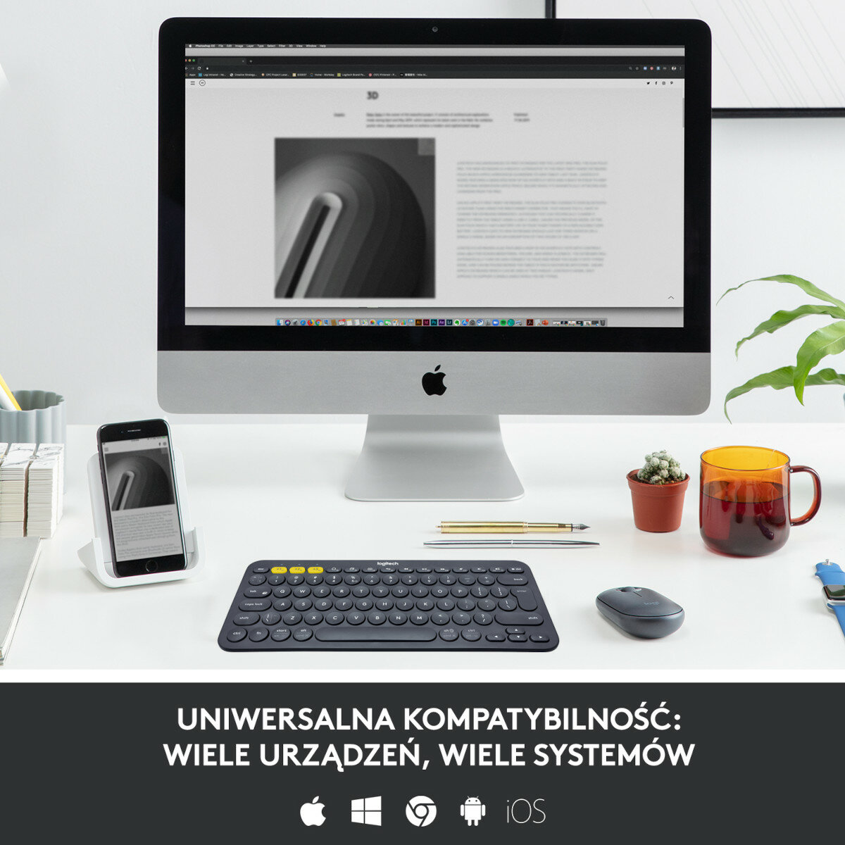 Biurko z telefonem, klawiaturą, myszą, kubkiem i iMac.