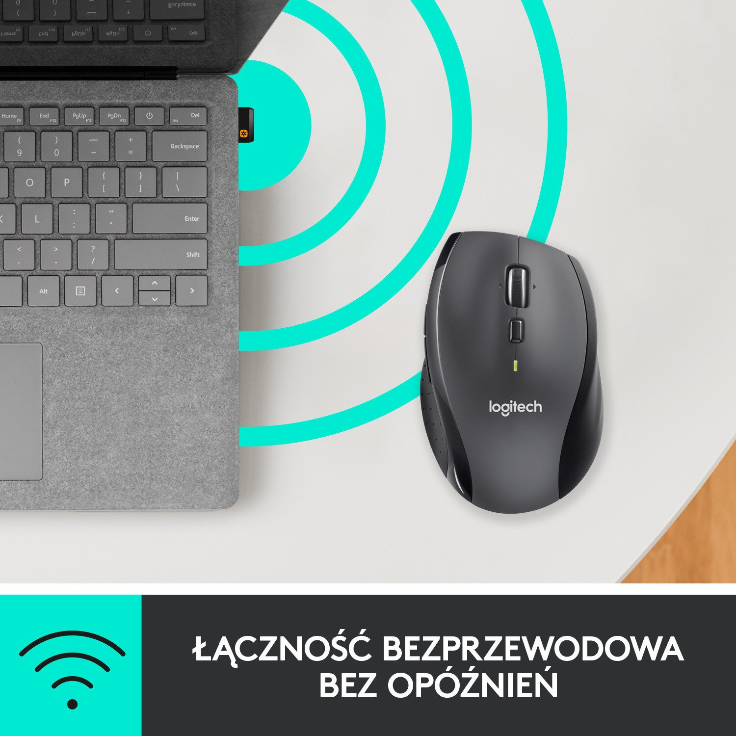 Bezprzewodowa mysz Logitech obok laptopa, z graficznym sygnałem.