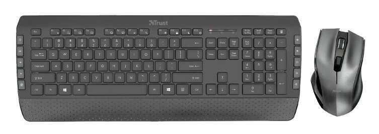 Czarna klawiatura Trust z pasującą myszą. Klawiatura ma wbudowaną podpórkę pod nadgarstek.