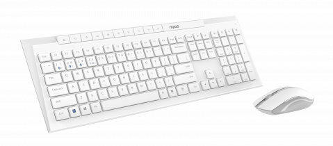 Biały zestaw klawiatura i mysz na białym tle. Klawiatura ma wiele klawiszy.