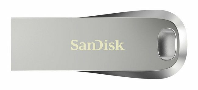 Srebrny pendrive Sandisk. Logo Sandisk jest wydrukowane na górze dysku.