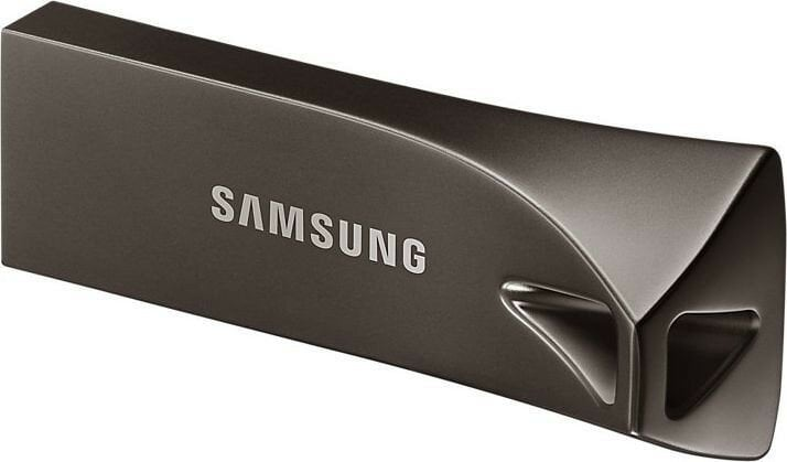 Ciemnoszary pendrive USB firmy Samsung, z nazwą marki i unikalnym designem.