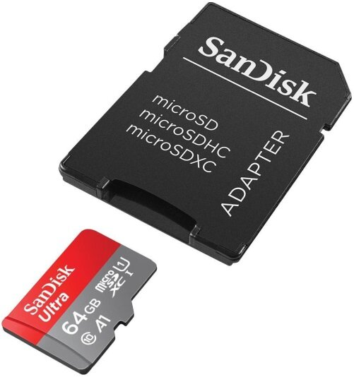 Karta microSD i adapter obok czarnego adaptera. Karta microSD jest czerwono-czarna.