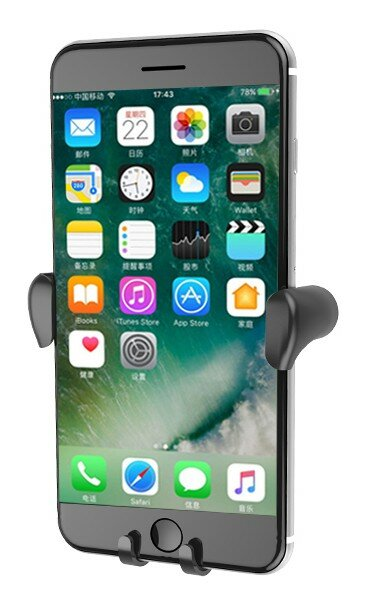 Szary uchwyt na smartfona trzyma iPhone z wieloma ikonami aplikacji na ekranie.