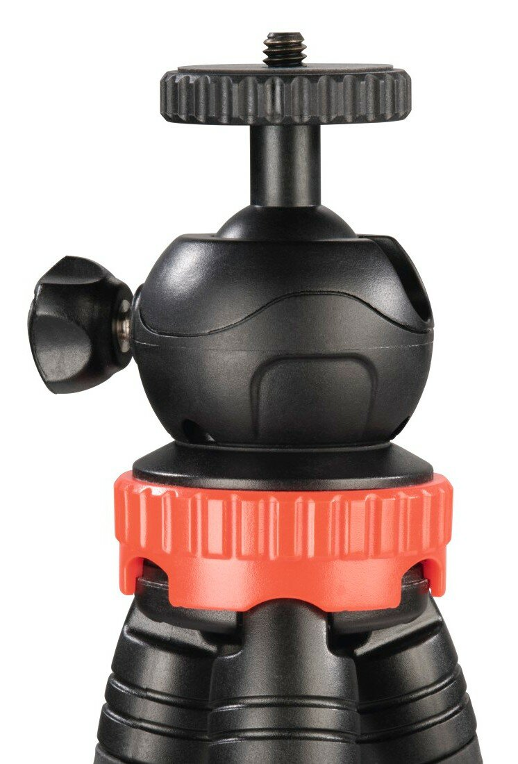 Czarna głowica statywu z czerwonym pierścieniem regulacyjnym i białym tłem.