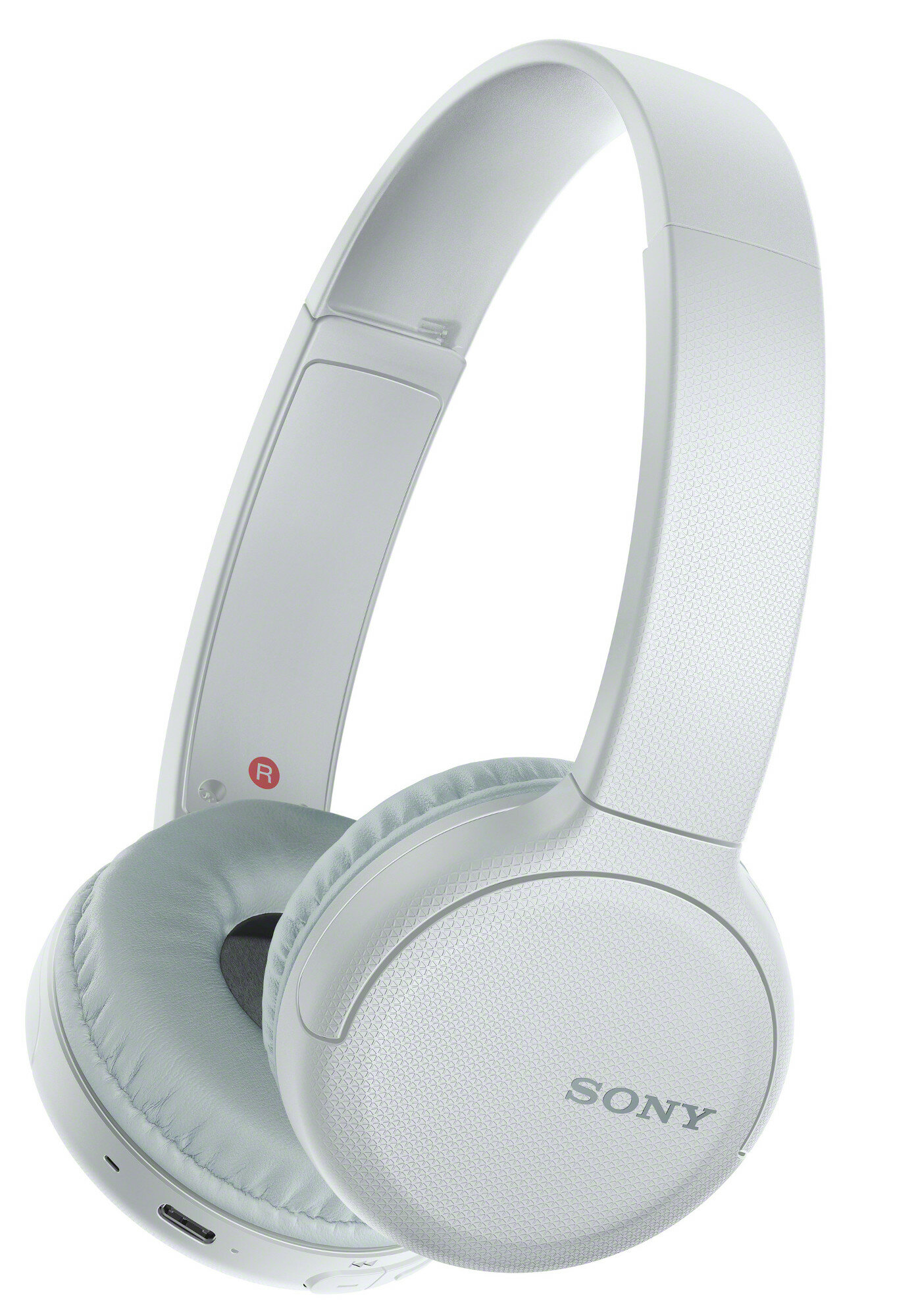 Jasnoszare słuchawki nauszne Sony. Widoczna nazwa marki. Białe tło.